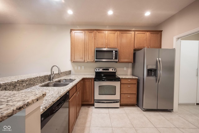 6586 Quail Run, Fishers, IN 46038 - kitchen featuring stainless steel appliances, light stone counters, recessed lighting, light tile patterned floors, and brown cabinetry