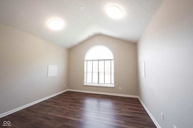 6586 Quail Run, Fishers, IN 46038 - unfurnished room with lofted ceiling and dark wood finished floors