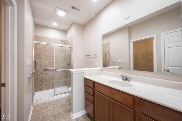 6586 Quail Run, Fishers, IN 46038 - full bathroom featuring a stall shower, vanity, a spacious closet, and tile patterned floors