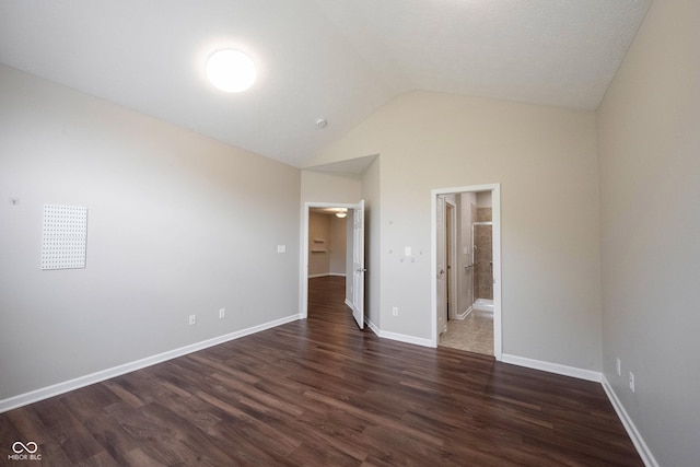 6586 Quail Run, Fishers, IN 46038 - unfurnished bedroom with lofted ceiling, dark wood-style flooring, and connected bathroom