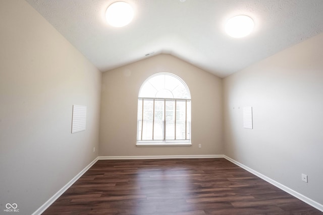 6586 Quail Run, Fishers, IN 46038 - empty room with lofted ceiling and dark wood finished floors