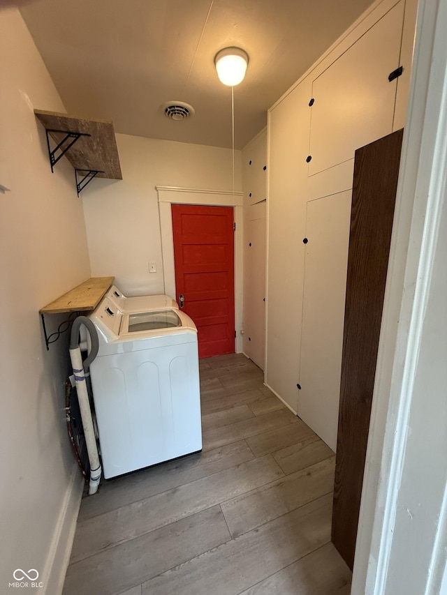 140 N Sycamore St, Dana, IN 47847 - laundry area with washer / clothes dryer and wood finished floors
