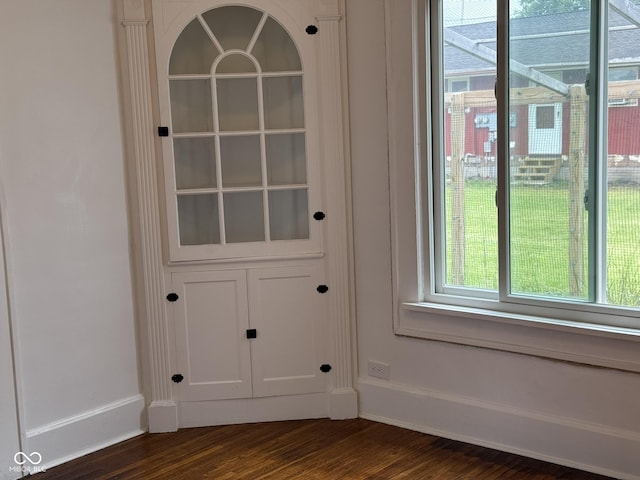 140 N Sycamore St, Dana, IN 47847 - doorway to outside featuring baseboards and dark wood-style flooring