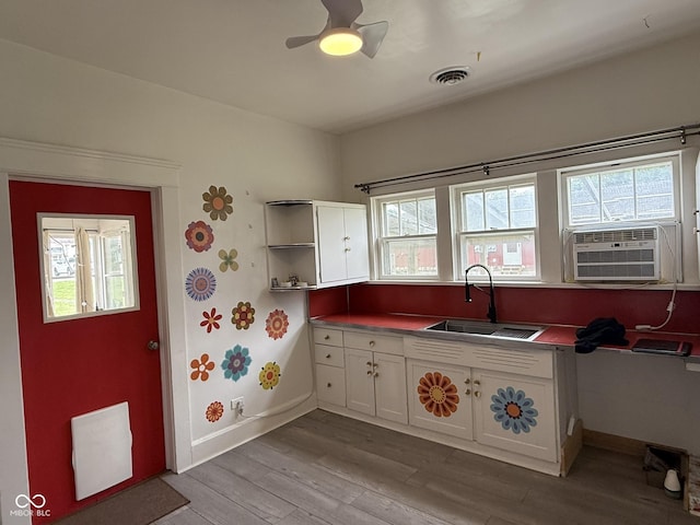 140 N Sycamore St, Dana, IN 47847 - kitchen featuring white cabinets, light wood-style floors, plenty of natural light, and open shelves