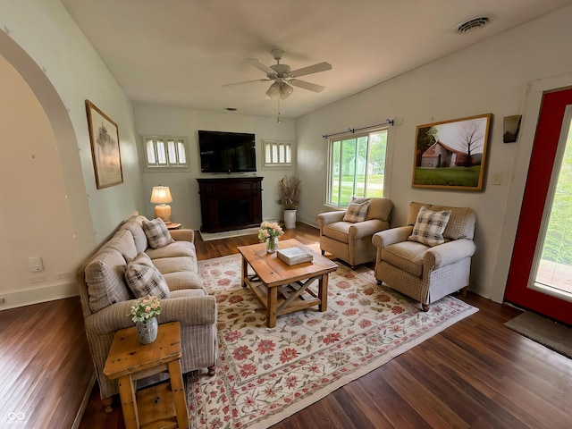 140 N Sycamore St, Dana, IN 47847 - living room featuring arched walkways, healthy amount of natural light, wood finished floors, and a ceiling fan