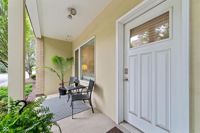 932 N Broadway St Unit 4, Indianapolis, IN 46202 - entrance to property with stucco siding and covered porch