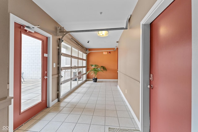 932 N Broadway St Unit 4, Indianapolis, IN 46202 - corridor featuring light tile patterned floors and baseboards