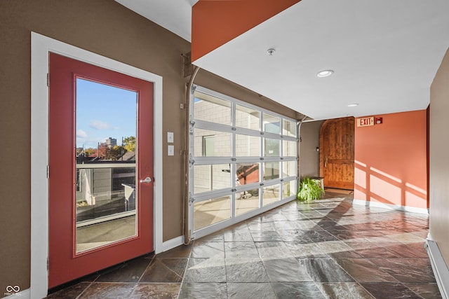 932 N Broadway St Unit 4, Indianapolis, IN 46202 - entryway featuring stone tile floors, plenty of natural light, and recessed lighting