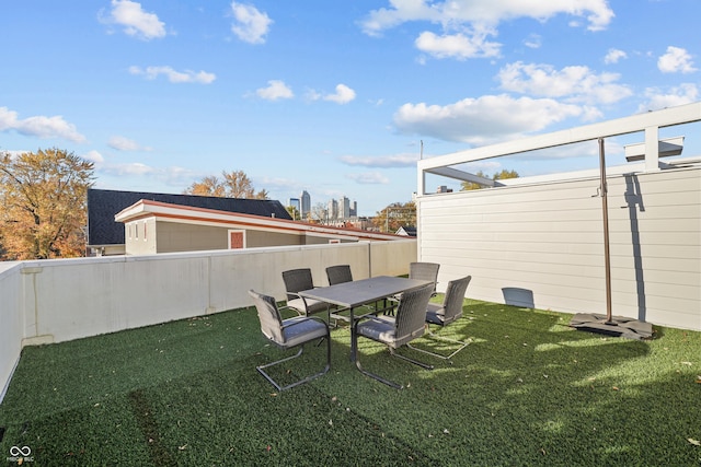 932 N Broadway St Unit 4, Indianapolis, IN 46202 - fenced backyard with outdoor dining space