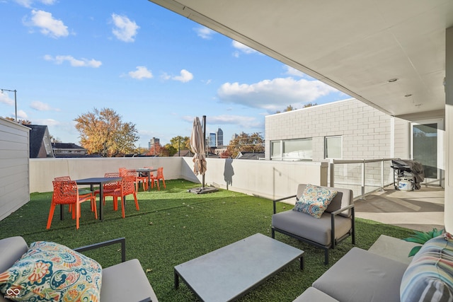 932 N Broadway St Unit 4, Indianapolis, IN 46202 - fenced backyard with a patio and an outdoor hangout area