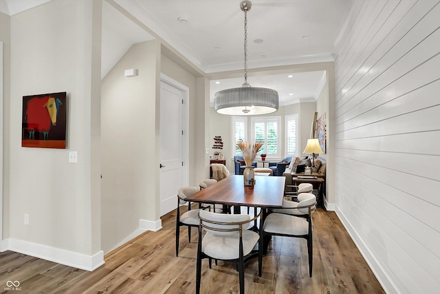 906 Berkhamsted Ln, Carmel, IN 46032 - dining area featuring wood finished floors, ornamental molding, and wood walls