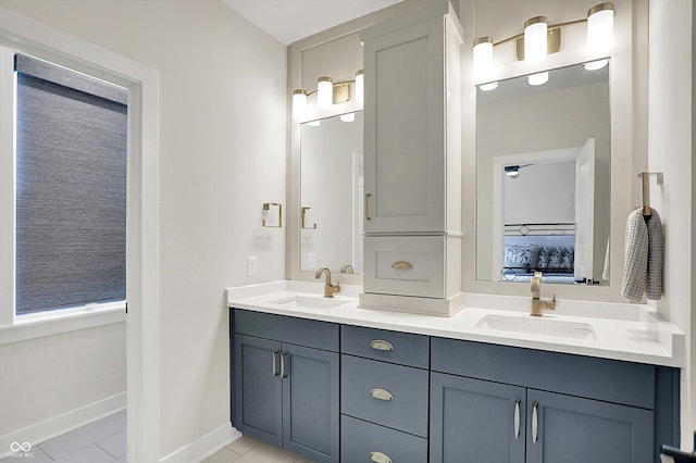 906 Berkhamsted Ln, Carmel, IN 46032 - full bath featuring double vanity, tile patterned flooring, and ensuite bath