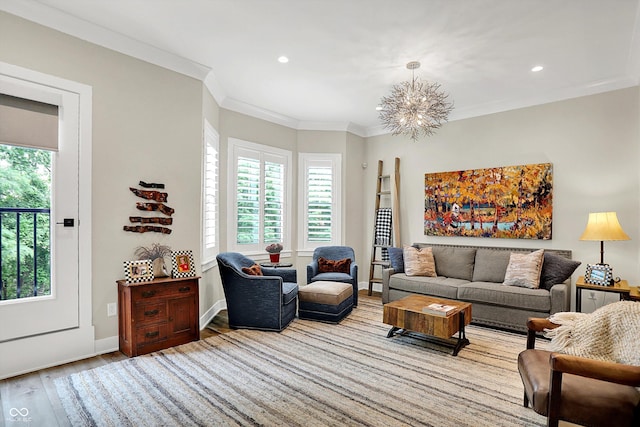 906 Berkhamsted Ln, Carmel, IN 46032 - living area with healthy amount of natural light, wood finished floors, a chandelier, recessed lighting, and ornamental molding