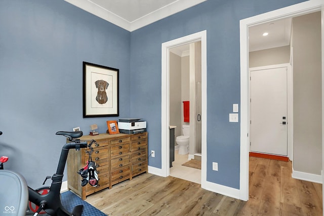 906 Berkhamsted Ln, Carmel, IN 46032 - bedroom featuring wood finished floors, connected bathroom, and ornamental molding