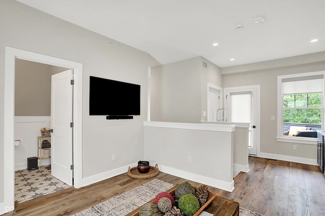 906 Berkhamsted Ln, Carmel, IN 46032 - living room with wood finished floors and recessed lighting