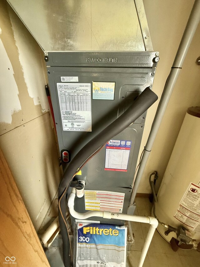 1687 Killion Ave, Seymour, IN 47274 - utility room featuring water heater and heating unit