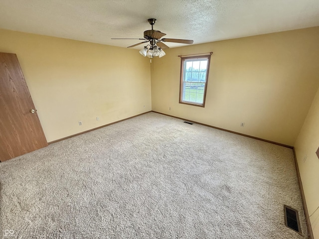1687 Killion Ave, Seymour, IN 47274 - unfurnished room with ceiling fan, carpet, and a textured ceiling