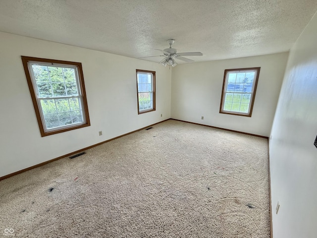 1687 Killion Ave, Seymour, IN 47274 - carpeted spare room with a textured ceiling and a ceiling fan