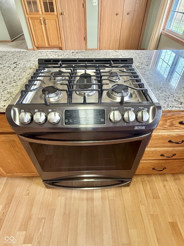 1687 Killion Ave, Seymour, IN 47274 - kitchen view of stainless steel gas stove and wood finished floors