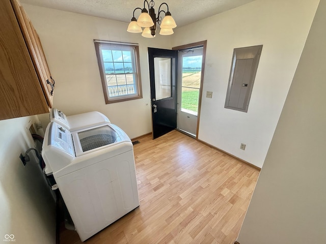 1687 Killion Ave, Seymour, IN 47274 - laundry area featuring cabinet space, electric panel, a chandelier, light wood finished floors, and separate washer and dryer