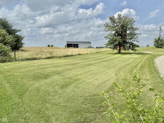1687 Killion Ave, Seymour, IN 47274 - view of green lawn with a pole building and an outdoor structure