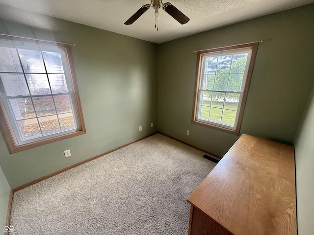 1687 Killion Ave, Seymour, IN 47274 - carpeted empty room with a ceiling fan and baseboards