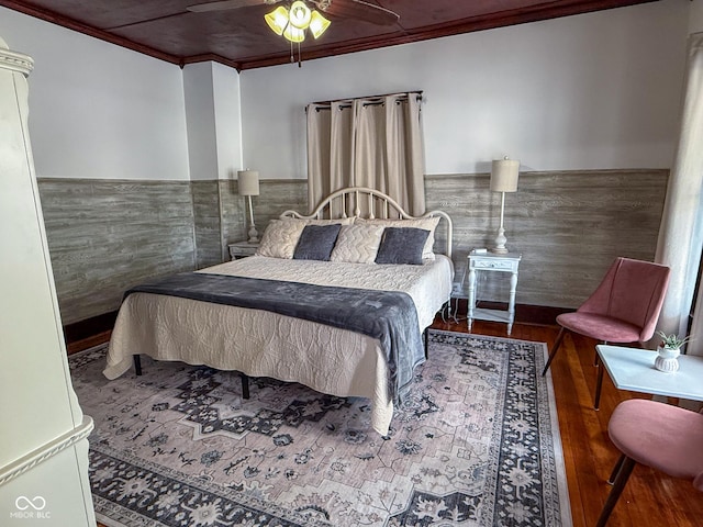 251 N St, Danville, IN 46122 - bedroom with ornamental molding, wood finished floors, a wainscoted wall, and ceiling fan