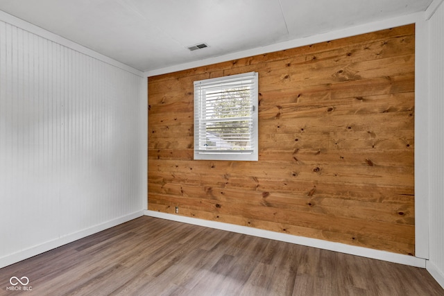 917 W Busby St, Lebanon, IN 46052 - unfurnished room featuring wood finished floors and wood walls