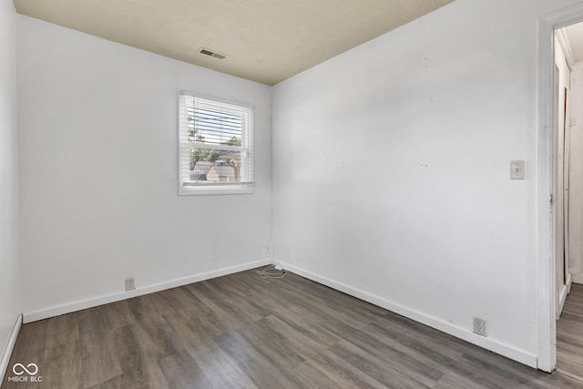 917 W Busby St, Lebanon, IN 46052 - spare room with dark wood-style flooring