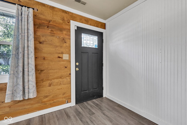 917 W Busby St, Lebanon, IN 46052 - entrance foyer featuring wood finished floors, healthy amount of natural light, and wood walls