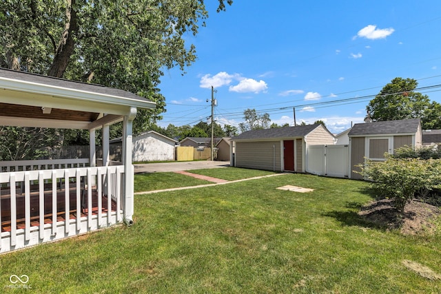 917 W Busby St, Lebanon, IN 46052 - view of yard featuring a storage shed, concrete driveway, and a gate