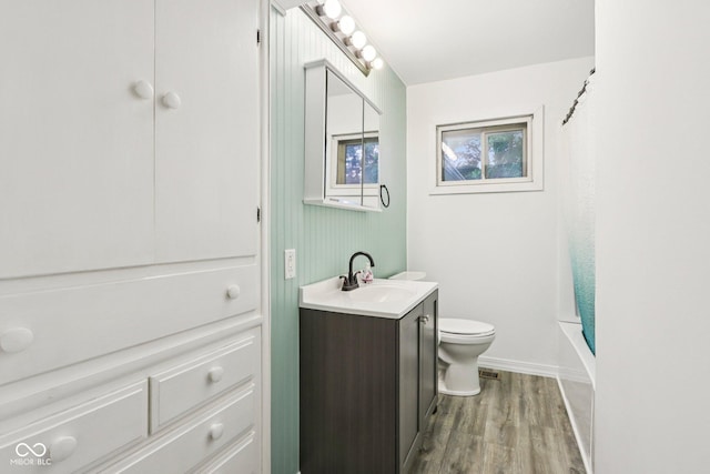 3921 S Lasalle St, Indianapolis, IN 46237 - full bath with vanity, wood finished floors, and shower / bath combo with shower curtain