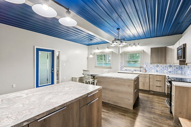 3921 S Lasalle St, Indianapolis, IN 46237 - kitchen featuring electric range, stainless steel microwave, a center island, light countertops, and wooden ceiling