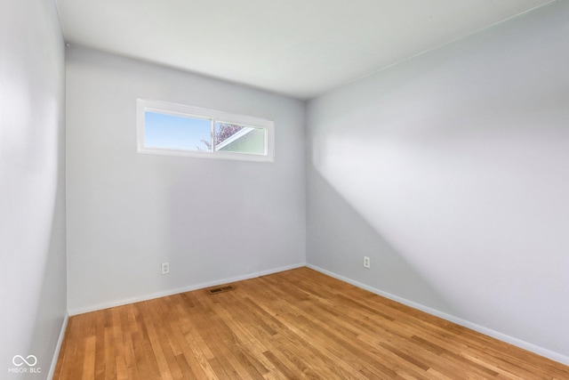 3921 S Lasalle St, Indianapolis, IN 46237 - spare room with light wood-style floors and baseboards