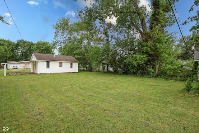 523 Patterson Rd, Columbus, IN 47203 - view of grassy yard featuring view of wooded area