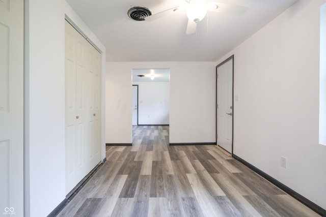523 Patterson Rd, Columbus, IN 47203 - unfurnished bedroom featuring wood finished floors, a closet, and ceiling fan
