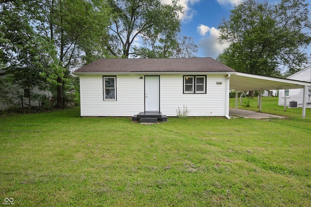 523 Patterson Rd, Columbus, IN 47203 - back of house with a carport and a yard