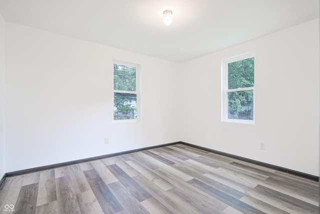 523 Patterson Rd, Columbus, IN 47203 - empty room featuring plenty of natural light and wood finished floors