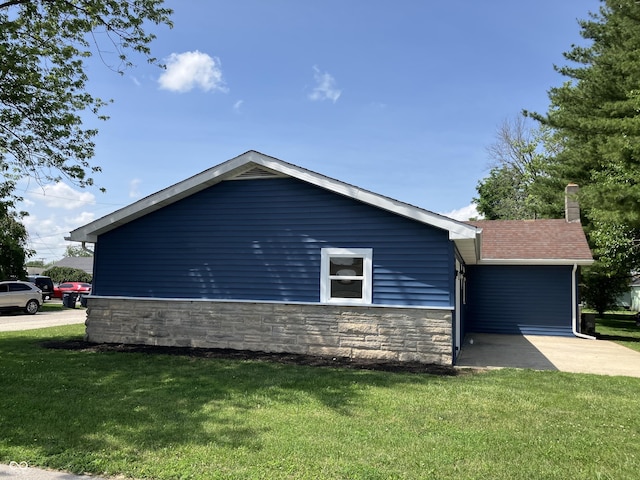 321 S 23rd St, Elwood, IN 46036 - view of property exterior with a chimney, a yard, and stone siding