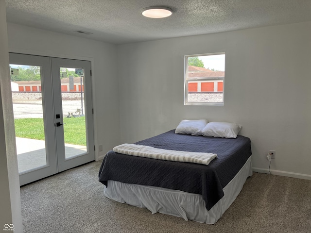 321 S 23rd St, Elwood, IN 46036 - carpeted bedroom with french doors, access to outside, and a textured ceiling