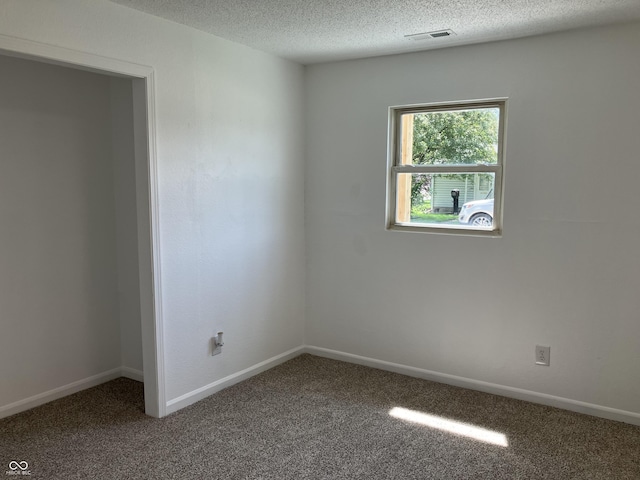 321 S 23rd St, Elwood, IN 46036 - carpeted spare room featuring a textured ceiling and baseboards