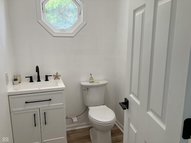 321 S 23rd St, Elwood, IN 46036 - bathroom featuring wood finished floors and vanity
