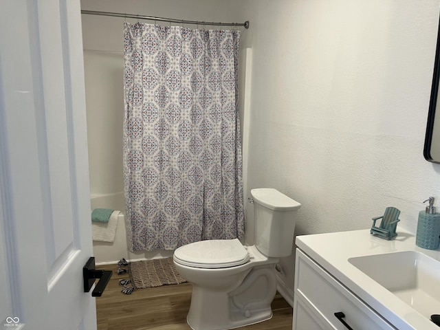 321 S 23rd St, Elwood, IN 46036 - bathroom featuring vanity, wood finished floors, and shower / tub combo with curtain