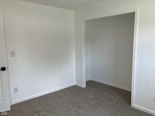 321 S 23rd St, Elwood, IN 46036 - empty room with dark carpet and baseboards