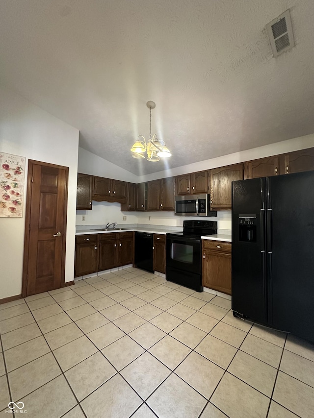 8849 Summer Walk Dr E, Indianapolis, IN 46227 - kitchen featuring black appliances, a chandelier, light countertops, vaulted ceiling, and dark brown cabinetry