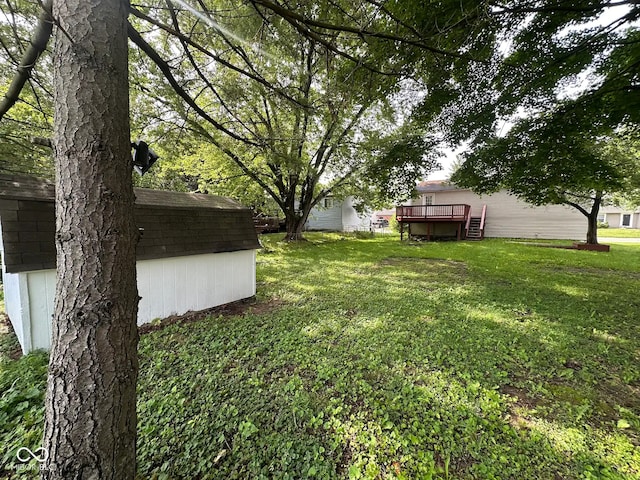 10316 Woodhaven Cir, Indianapolis, IN 46229 - view of grassy yard with a deck and a storage shed