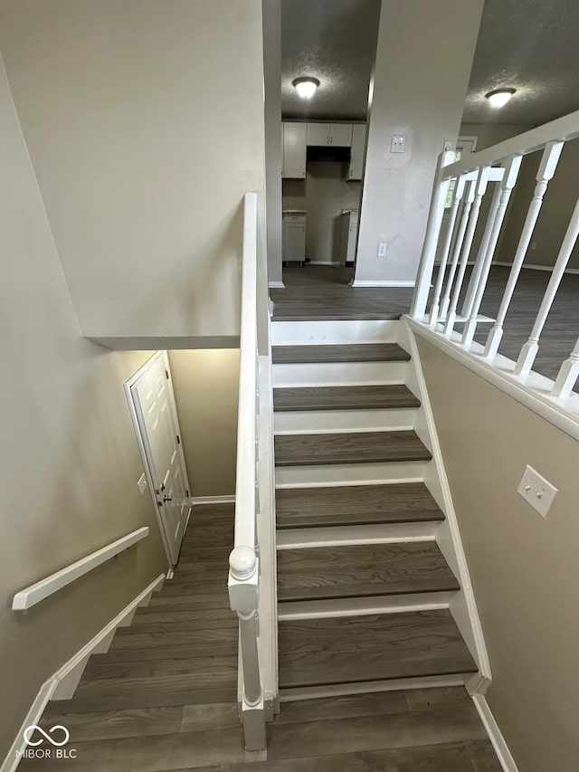 10316 Woodhaven Cir, Indianapolis, IN 46229 - staircase featuring wood finished floors and baseboards