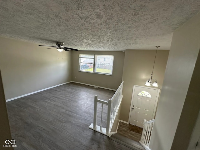 10316 Woodhaven Cir, Indianapolis, IN 46229 - foyer entrance with dark wood-style floors, a textured ceiling, and ceiling fan