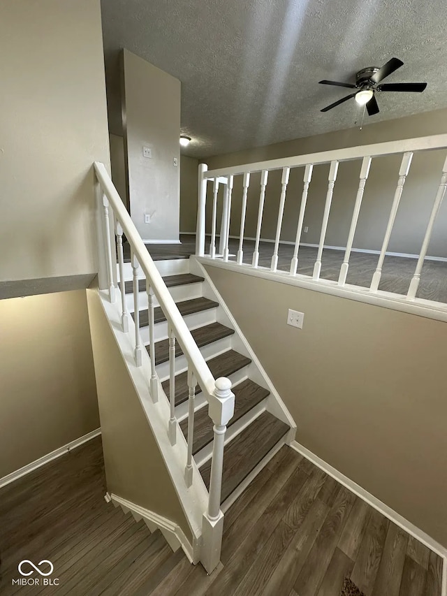 10316 Woodhaven Cir, Indianapolis, IN 46229 - stairs with wood finished floors, a ceiling fan, and a textured ceiling