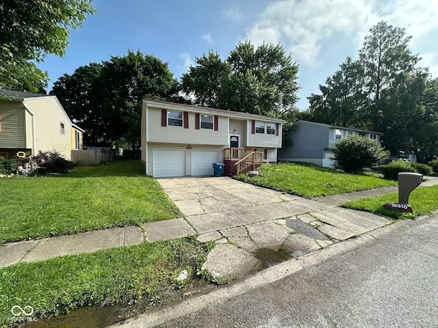 10316 Woodhaven Cir, Indianapolis, IN 46229 - bi-level home featuring concrete driveway and a garage